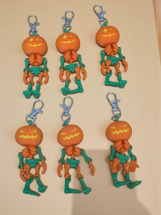 3D printed articulated Halloween pumpkin skeleton keychains
