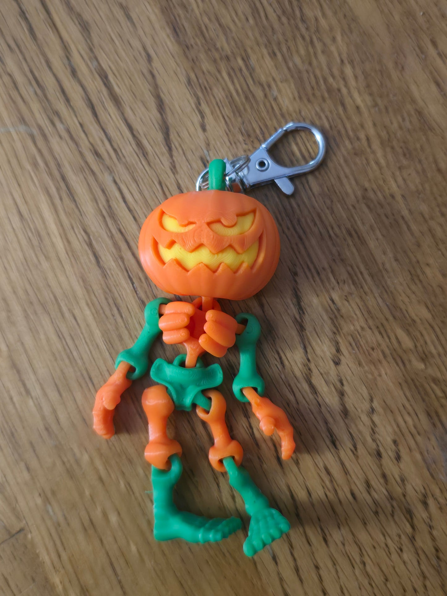 3D printed articulated Halloween pumpkin skeleton keychains